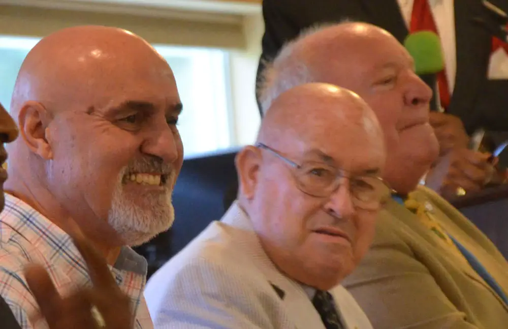 Palm Coast Council member Eddie Branquino, in the foreground, next to Jack Howell, during the election campaign two years ago. Both were elected. Howell defeated former Mayor Jon Netts, in the background, who was trying to return to the council. (© FlaglerLive)