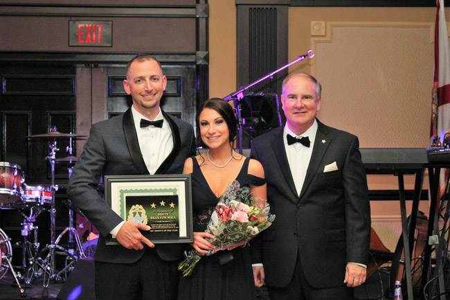 Braxton Hall, left, is the Flagler County Sheriff's Deputy of the Year. He accepted the award at Sheriff Rick Staly's (right) first annual gala for an employee trust fund Saturday evening. (FCSO)