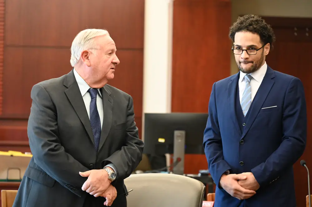 Brennan Hill, right, with his attorney, Gerald Bettman, this morning. (© FlaglerLive)