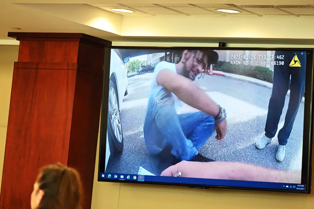 Brenan Hill at AdventHealth Palm Coast after bringing Savannah Gonzalez to the hospital with a. gunshot to the head. The image is of a body cam video shown the jury this morning during Hill's trial on a murder charge. In the video, Hill was lamenting the shooting--and lying about it. (© FlaglerLive)