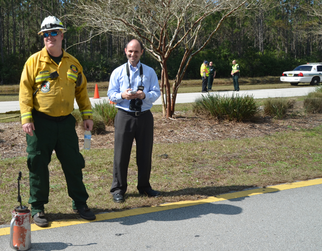 On the beat: Brian McMillan, right, with Will Raulerson of the Florida Forestry Service, at the Seminole Woods Boulevard fire earlier this week. (c FlaglerLive)