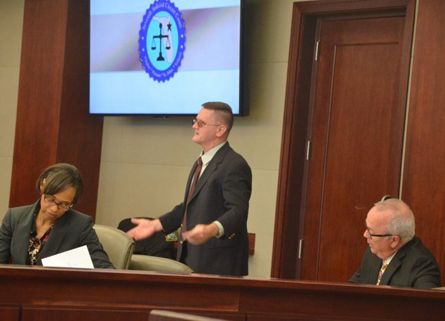 Bruce Haughton, center, who is accused of carrying out an assisted suicide, which is illegal in Florida, though he says he was attempting to kill himself and his girlfriend at the time. His attorneys are Assistant Public Defenders Rose Marie Peoples and Matt Phillips. (© FlaglerLive)