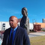 Equal Justice Initiative Executive Director Bryan Stevenson speaks to reporters on Wednesday, Feb. 14, 2024, in front of the recently unveiled statute of Rosa Parks in Montgomery. (Ralph Chapoco/Alabama Reflector)
