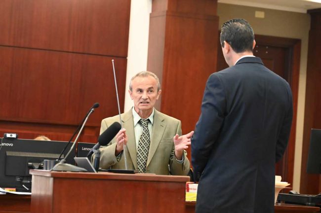 Dr. Bulic had a deadpan, highly precise way of explaining cases, as he did to Assistant State Attorney Jason Lewis during a trial. (© FlaglerLive)