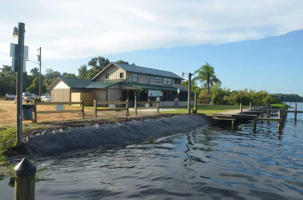 Bull Creek Fish Camp in 2014, when it was poised for a revival, with the waters of Dead Lake lapping at its banks. The waters flooded during the last two hurricanes, making the building uninhabitable, according to the county. The building will be torn down. (© FlaglerLive)