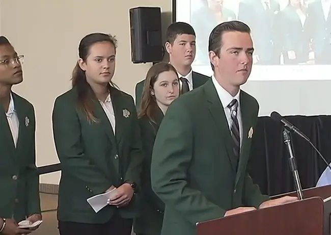 Five of the six students who form the Bulldog Patrol as they spoke to the Marjorie Stoneman Douglas commission Tuesday. From left, Gabrielle Jackson, Katia Martynuk, Abby Carver, Nicholas Blumengarten, and William Patin. Not pictured (but see below), Abbigail Carver. (© FlaglerLive via Florida Channel)