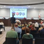 A prayerful Bunnell City Commission on Monday before spending most of a nearly three-hour meeting on an industrial rezoning of historic proportion. (© FlaglerLive)