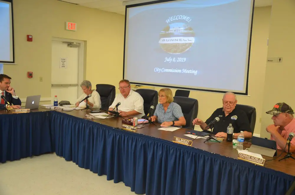 Bunnell city commissioners shortly before their vote to end the Sheltering Tree's operations of the cold-weather homeless shelter on Pine Street. The Justice Department investigation of the city will now burden City Attorney Wade Vose, left. (© FlaglerLive)