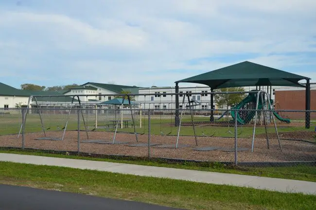 One of the playgrounds on the 20-acre Bunnell Elementary campus, where children were playing when a suspended student on the street side of the fence allegedly pulled a gun and pointed it at a student in the playground. That area of the school, along East Magnolia School, is oriented toward the northwest. (© FlaglerLive)