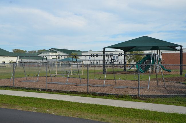 One of the playgrounds on the 20-acre Bunnell Elementary campus, where children were playing when a suspended student on the street side of the fence allegedly pulled a gun and pointed it at a student in the playground. That area of the school, along East Magnolia School, is oriented toward the northwest. (© FlaglerLive)