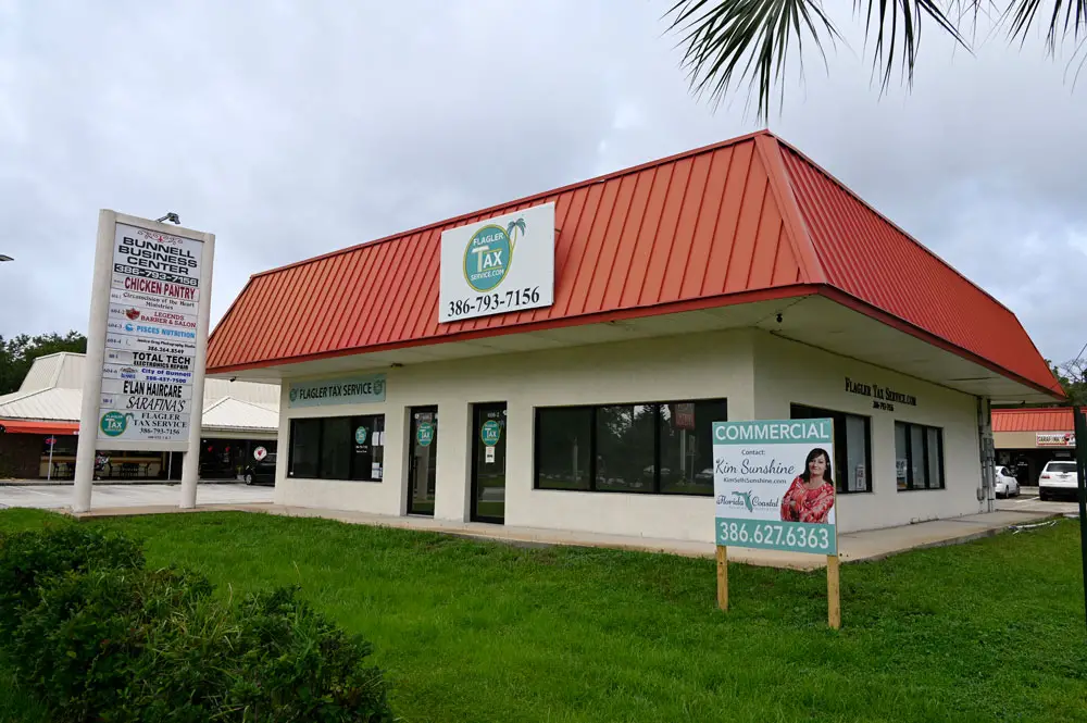 Flagler Tax Services operated for many years at the Bunnell Business Center, which includes the Chicken Pantry. The center was for sale. (© FlaglerLive)