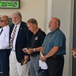 Jerry Cameron, fourth from right, at a recent county event, standing next to Jorge Salinas, the chief of staff and incoming interim county administrator. Cameron is ending his tenure in that role after two years and four months. (© FlaglerLive)