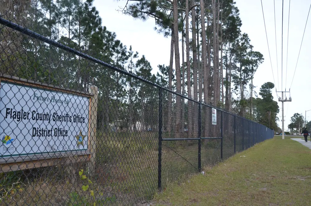It happened in Palm Coast when, in 2020, then-County Administrator Jerry Cameron had the homeless who'd encamped for years near the public library swept out, and the area fenced in, on the claim that the acreage would become a Sheriff's District Office. Months later, Cameron shifted the location of the Sheriff's facility back to Bunnell. By then, the homeless had been dispersed. (© FlaglerLive)