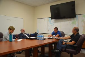 Cameron in his interview with Commissioner Joe Mullins, with Lynne Rosewater, left, and Chamber President Jorge Gutierrez. (c FlaglerLive)