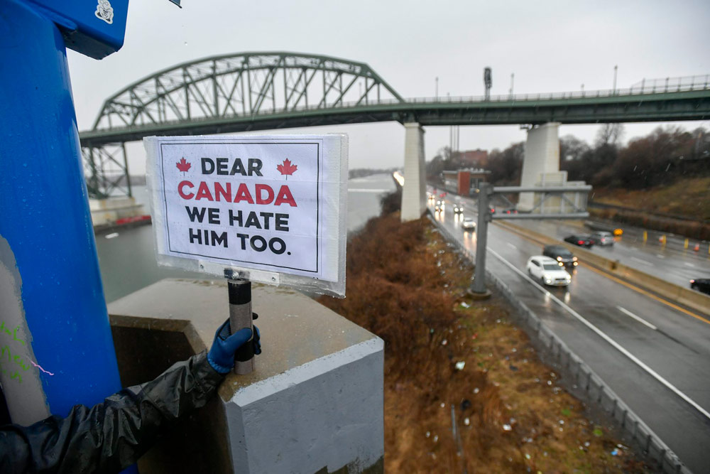 American ‘Elbows Up for Canada’ protesters gather near The Peace Bridge border crossing in Buffalo, N.Y., in April 2025.