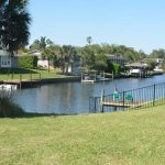 The saltwater canals in Palm Coast's C-Section and a sliver of the F-Section have been an attractive amenity since the city's origins in the 1960s and 70s, when ITT Levitt dug them out. But they've never been dredged since, and the silt is accumulating. The question is: how much will it cost to dredge, and who should pay? (© FlaglerLive)