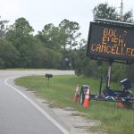 A road sign on County Road 13 just ahead of the Fairgrounds this afternoon, on the cancelled "Boots on the Ground" event. The actual wording does not look chancy to drivers: that's only the shutter's doing. (© FlaglerLive)