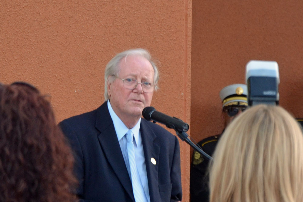 Former Palm Coast Mayor Jim Candfield, speaking at the dedication of the new City Hall in Town Center in 2015. (© FlaglerLive)