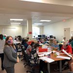 The Flagler County Canvassing Board and other elections office workers put in a full day going through mail-in ballots Wednesday. Elections Supervisor Kaiti Lenhart is in the foreground, to the left. (© FlaglerLive)