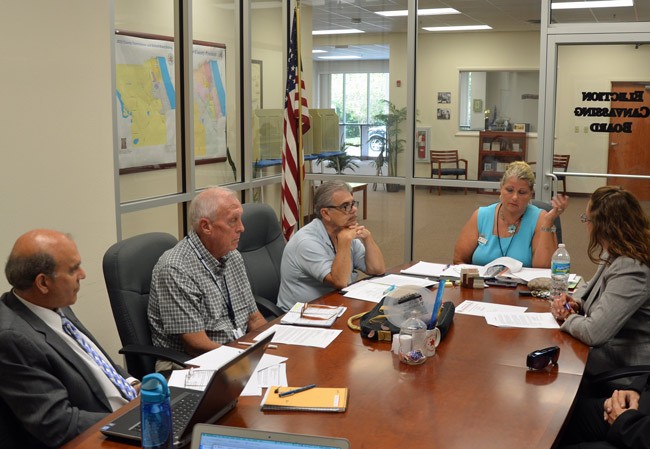 Days of controversy: Ex-Supervisor of Elections Kimberle Weeks, at the head of the table, in a canvassing board meeting in August, with, from left, County Attorney Al Hadeed, Commissioners Charlie Ericksen and George Hanns, both of whose resignations from the canvassing board Weeks forced, and County Judge Melissa Moore-Stens, who also called for Hanns's resignation. He was replaced by Commissioner Barbara Revels. (© FlaglerLive)