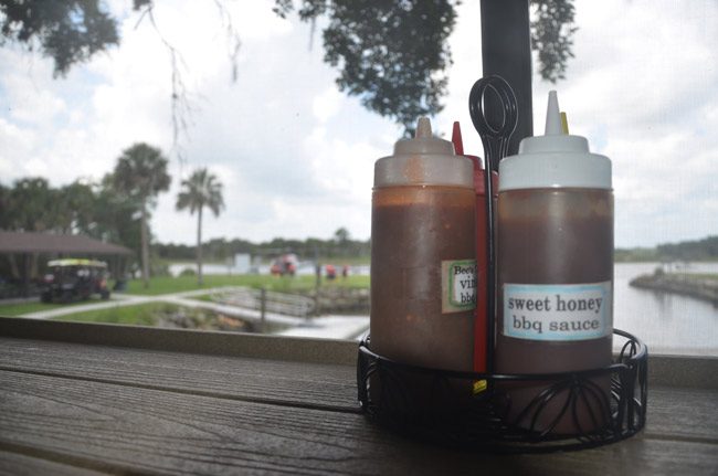 It is becoming increasingly likely that Captain's BBQ at Bing's Landing will be moved closer to the Intracoastal Waterway, in place of a pavilion and popular gathering spot. (© FlaglerLive)