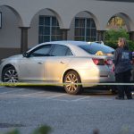 Detectives and crime scene investigators were processing the vehicle--in which the two victims were shot--at Palm Coast Fire Station 25 this morning. The vehicle was bullet-ridden from behind. (c FlaglerLive)