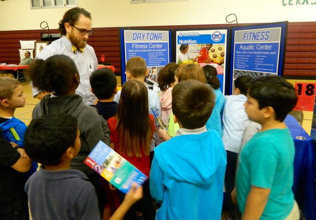 Daytona State College's Zachary Cordell with students during Rymfire Elementary's Career Day last Friday. (Melanie Tahan)