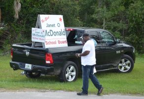 Carl Jones taking a moment to wipe his brow less than two hours before polls closed this evening, as he campaigned off Old Kings Road. Click on the image for larger view. (© FlaglerLive)