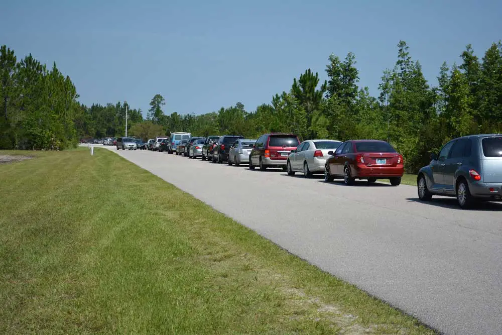 The car line every Saturday and Sunday leading into Grace Community Food Pantry on Education Way off U.S. 1. It usually extends out and up the highway. (Grace Community)