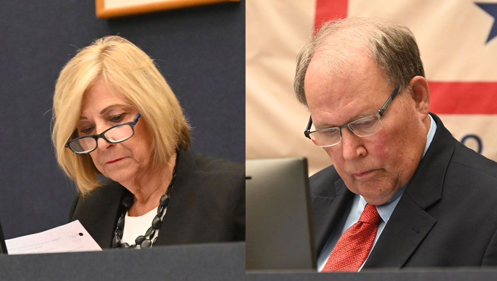 Not on the same page: County Commissioners Kim Carney and Greg Hansen. (© FlaglerLive)