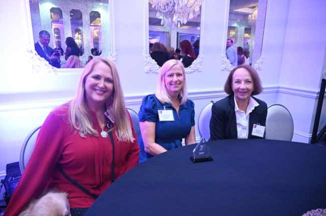 From left, DJ Lebo, Carrie Baird and Barbara Revels. (© FlaglerLive)