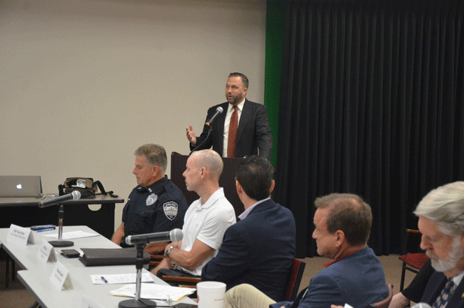 St. Augustine City Attorney John Cary addressed the Flagler Public Safety Coordinating Council on St. Augustine's experience with a strict new ordinance cracking down on homelessness and panhandling this morning. Bunnell Police Chief Tom Foster, left, represented the one city in Flagler that followed St. Augustine's lead, with a similar ordinance, though limiting penalties to civil citations, not criminal charges. (© FlaglerLive)