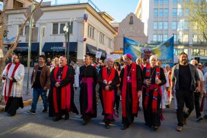 Catholic bishops invited by Mark Seitz, center, the bishop of El Paso, Texas, lead a march in solidarity with migrants on March 24, 2025, in downtown El Paso.