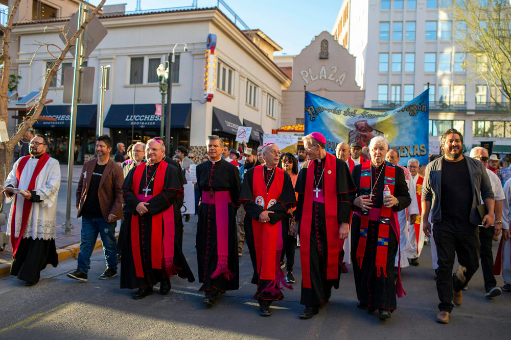 Catholic bishops invited by Mark Seitz, center, the bishop of El Paso, Texas, lead a march in solidarity with migrants on March 24, 2025, in downtown El Paso.
