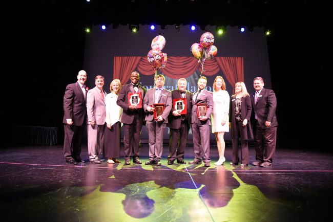 The celebrants, from left: Superintendent Jacob Oliva, School Board Chairman Trevor Tucker, School Board member Janet McDonald, Principal of the Year Earl Johnson, Employee of the Year Brandon Seminara, Assistant Principal of the Year Kenny Seabold, Teacher of the Year Andrew Hutcheson, and School Board members Colleen Conklin, Maria Barbosa and Andy Dance. Click on the image for larger view.