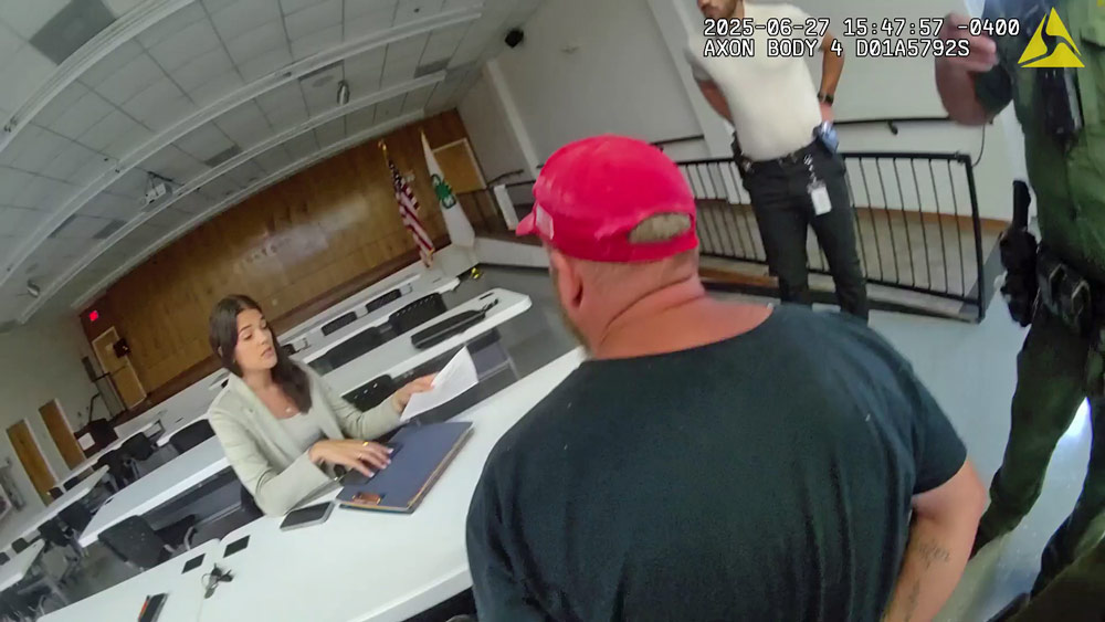 Gregory Alllen Smith being read his charges at his place of work on Friday. (FCSO)