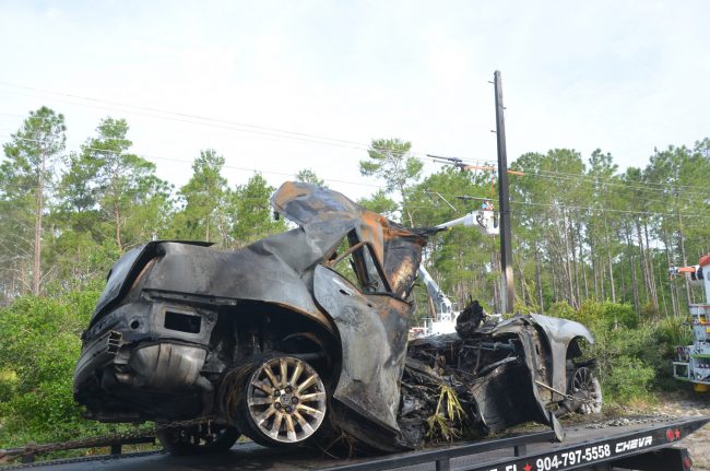 The Chrysler and the charred utility pole in the background. 