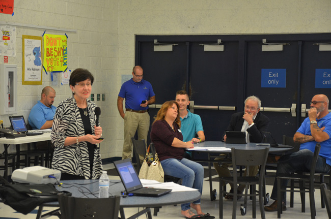 Marylin Crotty, in the foreground, 'facilitating' last week's charter-review workshop at Matanzas High School, which was attended by 13 people (city staff and council members not included). Members of the city council sat to the side: Heidi Shipley, Nick Klufas, Bob Cuff and Steven Nobile. (c FlaglerLive)