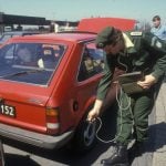 A German security guard checks for radiation after the Chernobyl accident in April 1986. Patric