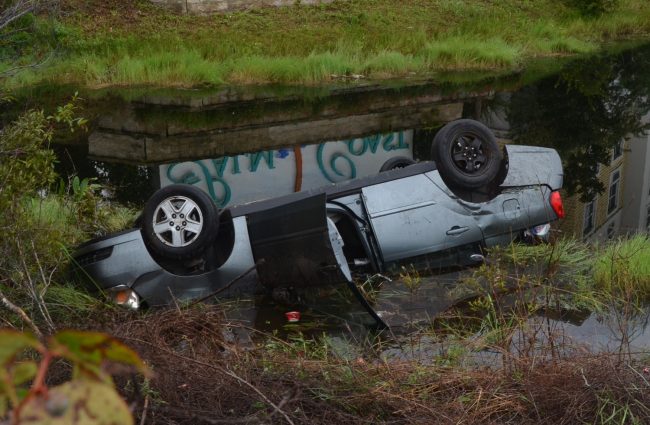 The Chevy Malibu in the pond. Click on the image for larger view. (© FlaglerLive)