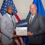 FBI Unit Chief Corey Hudson (left) presents Bunnell Police Chief David Brannon (right) a Certificate of Completion for the FBI’s National Command Course, Session 8.