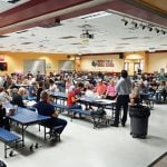 Land use attorney Michael Chiumento, who is representing the developer of the former Matanzas golf course in Palm Coast's L-Section, addressing a crowd of 120 people at a neighborhood meeting on the proposal at Indian Trails Middle School last Tuesday. (© FlaglerLive)