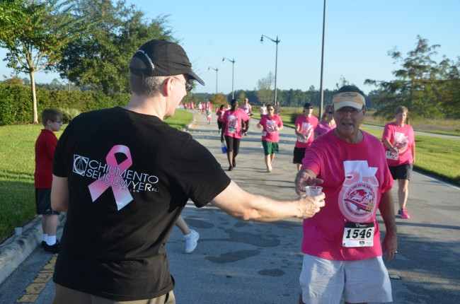 Chiumento Selis Dwyer Attorney Vincent Lyon was on water duty, to the relief of Bob Weber, the chief spokesman of the Flagler County Sheriff's Office., who participated in the run with his wife. Click on the image for larger view. (© FlaglerLive)