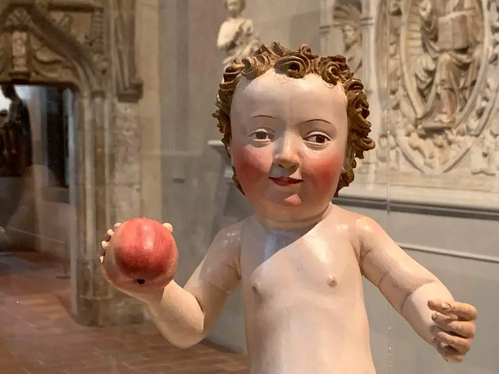 "Christ Child with an Apple," from the workshop of Michel Erhart (1464-1522), on display at the Cloisters in New York. (© FlaglerLive)