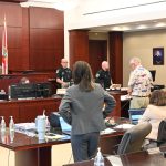 Kevin Cichowski, in the orange garb to the right, at his bond hearing last year before Circuit Judge Dawn Nichols. (© FlaglerLive)
