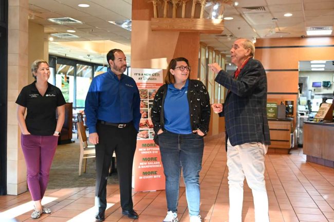 Alfin and city staff.. From left, -Interim Manager Lauren Johnston, Chief of Staff Jason DeLorenzo, and Communications and Marketing Manager Shannon Martin. (© FlaglerLive)