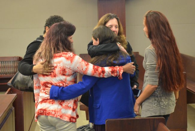 Assistant State Attorney Melissa Clark and the family after the verdict. Tiffany Norman is in the blue jacket. (© FlaglerLive)