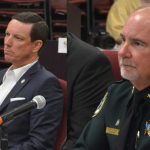 Flagler County Clerk of Curt Tom Bexley, left, and Sheriff Riock Stalky, seen here in a file photo, demurred when Commission Chair Andy Dance asked them if they were going to participate in the state's doge-like efficiency drive, citing the fact that the state did not direct its letter to them,. (© FlaglerLive)