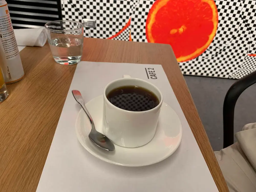An untouched cup of coffee at the Museum of Modern Art, New York. (© FlaglerLive)