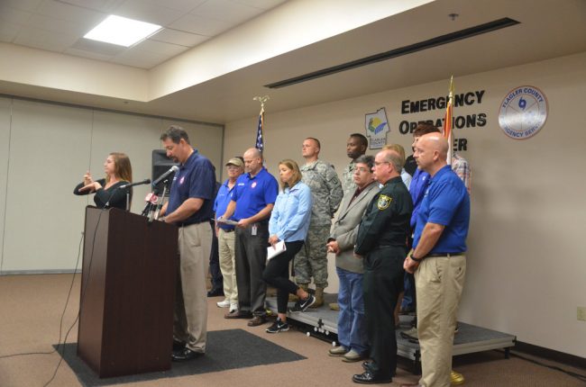 Craig Coffey at the podium during a press conference the night before Hurricane Matthew's closest approach to Flagler. Click on the image for larger view. (© FlaglerLive)